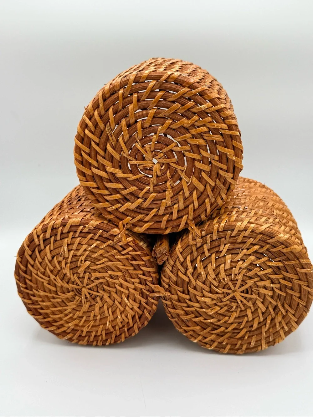 Vintage three-compartment woven rattan caddy/basket with a central loop handle